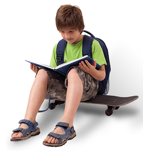 Child on skateboard reading